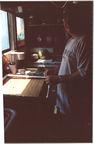 After Breakfast, John caulks the new kitchen window